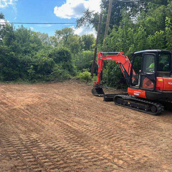excavator grading in a private property